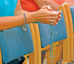 People pray on Sept. 15 in SS. Peter and Paul Cathedral in Indianapolis during a “Holy Hour for Prayer, Penance and Healing” for victims of sexual abuse. Three parishes in the Indianapolis North Deanery held listening sessions or a similar holy hour in response to the current clergy sexual abuse crisis. (Photo by Natalie Hoefer)