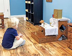 Sylvia Tews, a student at Annunciation Catholic Montessori School in Brazil, prays during the religions education program called Catechesis of the Good Shepherd. Sylvia was learning about the holy vessels of the altar that are used in Mass.  (Submitted photo)