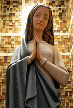 This statue of the Blessed Mother can be found in St. Mary-of-the-Knobs Church in Floyd County, where 83-year-old parishioner Mary Becht leads a rosary group every Tuesday at 1 p.m. (File photo by Natalie Hoefer)