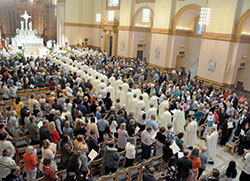 Archbishop Charles C. Thompson and priests serving in central and southern Indiana process on April 16, 2019, into SS. Peter and Paul Cathedral for the annual chrism Mass. Catholics from across the archdiocese are invited to take part in a variety of ways to contribute to a process of preparation underway now for a 2023 meeting of the Synod of Bishops at the Vatican. (File photo by Sean Gallagher)