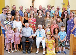 Hubert and Eulalae Hagedorn hold hands while surrounded by many of their children, grandchildren and great-grandchildren in St. Mark Church in Perry County on June 10, 75 years after they wed in the very same spot. (Photo by Natalie Hoefer)