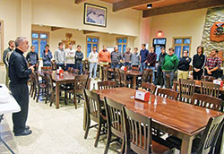 Father Joseph Moriarty, second from right, rector of Bishop Simon Bruté College Seminary in Indianapolis, speaks to seminarians and Castle Night participants on Nov. 16, 2022, in the seminary dining hall. Sponsored by the archdiocesan Office of Vocations, Castle Night brings high school boys open to a possible priestly vocation to the seminary for prayer, a meal and time shared with seminarians and other high schoolers like themselves. (Photo by Sean Gallagher)