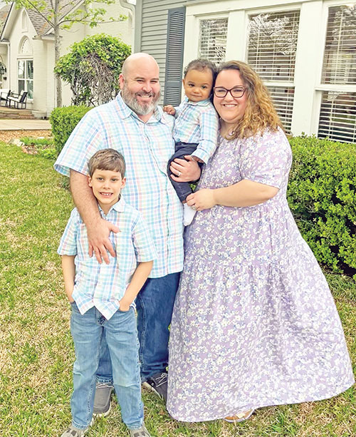 Lauren Allen poses with her husband Sean and their adopted sons Peyton (standing) and Mitchell in a recent family photo. (Submitted photo)