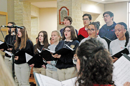 A choir composed of seniors from Catholic high schools across the archdiocese sings during a Mass with Archbishop Charles C. Thompson at St. Malachy Church in Brownsburg on Dec. 4. (Photo by John Shaughnessy)