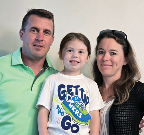 Widd, left, Elena and Jamie Lewis pose in a recent photo. The couple were welcomed into the full commmunion of the Church at St. Rose of Lima Church in Franklin on April 19. Elena attends the parish’s pre-school.  (Submitted photo.)