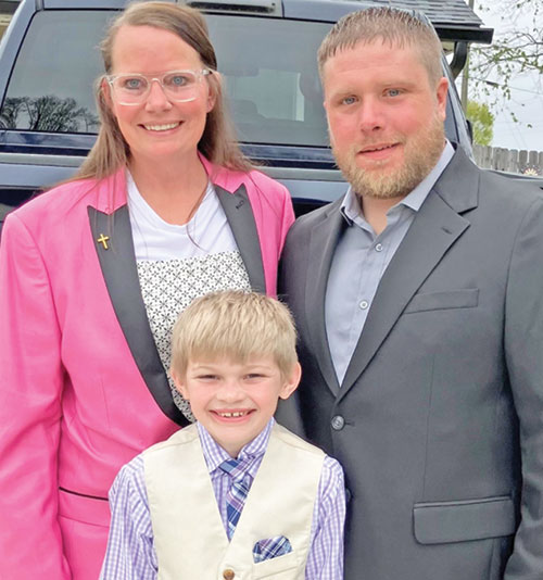 Bethany, left, Xander and James Skaggs pose for a family photo before heading to St. Rose of Lima Church in Franklin on April 19 for the parish’s Easter Vigil Mass, during which the family was welcomed into the full communion of the Church. (Submitted photo)