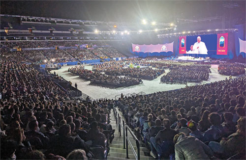 Some 16,000 Catholic teenagers from across the country worship on Nov. 22 in Lucas Oil Stadium in Indianapolis during the closing Mass of the National Catholic Youth Conference. (Photo by Sean Gallagher)