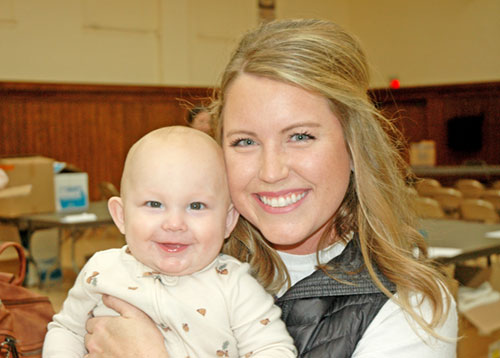 While leading 18 youths from St. John Paul II Parish in Sellersburg at the National Catholic Youth Conference on Nov. 20-22, Katie Tipker also brought her 8-month-old son George with her. (Photo by John Shaughnessy)