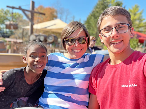 Nolan McCracken shares a moment of joy with his mother Becca and sister Ruby—two of the people that Nolan, in his talk before 16,000 people at the National Catholic Youth Conference in Indianapolis on Nov. 20, credited with bringing him closer to God. (Submitted photo)