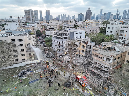 A drone photo shows the damage to residential homes in Tel Aviv, Israel, June 16, 2025, at the impact site of a missile attack from Iran. Iran fired a new wave of missiles on Israel early June 16, killing several people, while Israel warned residents in part of Tehran to evacuate ahead of new strikes. (OSV News photo/Moshe Mizrahi, Reuters)