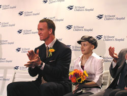 Indianapolis Colts quarterback Peyton Manning sits with 14-year-old Sydney Taylor of Brownsburg. Sydney introduced the Colts quarterback at a Sept. 5 press conference where it was announced that St. Vincent Children’s Hospital in Indianapolis would be renamed Peyton Manning Children’s Hospital at St. Vincent.