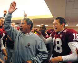 Indiana University head football coach Bill Lynch leads the celebration in the Hoosiers’ locker room after IU’s last-minute win over Purdue University on Nov. 17. The win capped an emotional season for the team, which was rocked earlier in the year by the death of its previous coach, Terry Hoeppner. (Photo by Paul Riley, IU Athletics)