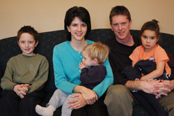 Couple to Couple League members and Natural Family Planning teachers Mike and Ann Green of Carmel, Ind., pose for a family portrait with their children, Jimmy, from left, John Paul and Mary. They are members of St. Alphonsus Parish in Zionsville, Ind. (Photo by Mary Ann Wyand)	