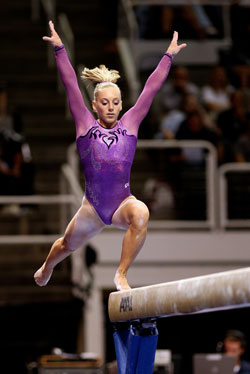 Olympic hopeful Samantha Peszek, a junior at Cathedral High School and member of St. Simon the Apostle Parish, both in Indianapolis, performs on the balance beam during a competition. (Submitted photo)