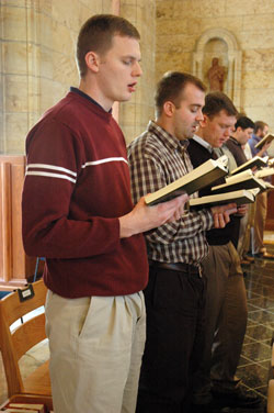 Archdiocesan seminarian David Proctor, left, and Jeff Read, a seminarian for the Evansville Diocese, sing a hymn during Mass on Dec. 4 at the seminary’s St. Thomas Aquinas Chapel. Proctor, a member of Our Lady of the Greenwood Parish in Greenwood, is a second-year theology student at Saint Meinrad. (Photo by Sean Gallagher) 
