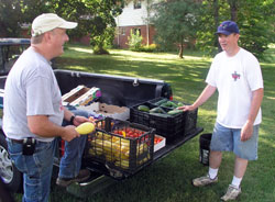 Tim Jerger, left, and John Naddy lead a parish garden at St. Matthew the Apostle Parish in Indianapolis, which supplies food for the poor and the hungry. (Photo by John Shaughnessy)