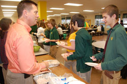 As the president of the two Prince of Peace Schools in Madison, Philip Kahn has tried to be a visible presence to students at Pope John XXIII School and Father Michael Shawe Memorial Jr./Sr. High School. Near Thanksgiving, he joined staff members and teachers at the high school to serve a traditional feast to students. (Submitted photo)