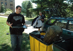 Aaron Foshee, left, a seminarian for the Archdiocese of Oklahoma City studying at Saint Meinrad Seminary and School of Theology in St. Meinrad, helps Archdiocese of Indianapolis seminarian Anthony Hollowell, right, move his belongings into the southern Indiana seminary on Aug. 26. The seminarian enrollment at Saint Meinrad is at a 25-year high this year. (File photo by Sean Gallagher)