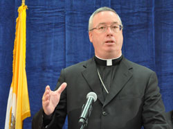 Bishop Christopher J. Coyne speaks during the Sept. 21 press conference announcing Archbishop Daniel M. Buechlein’s retirement from active ministry. Pope Benedict XVI appointed Bishop Coyne the archdiocese’s apostolic administrator. (Photo by Mary Ann Garber)