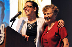 Pro-life activist Eva Muntean, left, of San Francisco hugs her mother, also named Eva Muntean, who is a member of St. Bartholomew Parish in Columbus, following her keynote speech at “God Alone,” the 2011 Indiana Catholic Women’s Conference, on Sept. 17 at Cathedral High School in Indianapolis. (Photo by Mary Ann Garber)