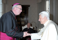 Pope Benedict XVI greets Bishop Christopher J. Coyne, apostolic administrator, during a Feb. 9 meeting with bishops from Indiana on their ad limina visits to the Vatican. Bishops from Illinois, Indiana and Wisconsin were making their ad limina visits to the Vatican to report on the status of their dioceses. (CNS photo/L'Osservatore Romano)