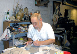 John McCarthy, a member of Most Sacred Heart of Jesus Parish in Jeffersonville, works on the Station of the Cross that he created for St. Raphael Parish in Saint-Raphael, Haiti. Under the pastoral leadership of Father Thomas Clegg, Sacred Heart and St. Augustine parishes, also in Jeffersonville, have developed a longtime relationship with the Haitian parish. (Submitted photo)