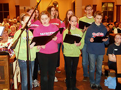 High school students from the New Albany Deanery sing in a youth choir prior to Archbishop Joseph W. Tobin’s welcome Mass at St. Mary-of-the-Knobs Church in Floyd County on Jan. 29. Several choirs sang before and during the liturgy. (Photo by Patricia Happel Cornwell)