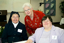 Susan Robinson, center, smiles with Daughters of Charity Sister Rosaria Raidl, left, and New Hope participant Dana Zunk after Robinson received the St. Vincent New Hope “Hope Award” at St. Vincent New Hope in Indianapolis. (Submitted photo)