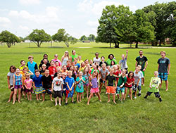 Children, teenagers and volunteer college student teachers shout for joy on June 20 at St. Barnabas Parish in Indianapolis at the conclusion of a Totus Tuus vacation Bible school at the Indianapolis South Deanery faith community. (Submitted photo)