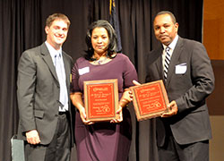 Marc Tuttle, president of Right to Life of Indianapolis, left, poses on Sept. 30 with Sally Williams and Marcellus Martin of Solid Word Bible Church after presenting them with the Charles E. Stimming, Sr. Pro-Life Award that the church received. (Photo by Natalie Hoefer)