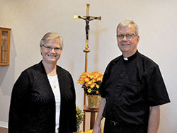 Benedictine Sister Mary Ann Koetter and her brother, Msgr. Paul Koetter, pose on Sept. 28 in the chapel of Our Lady of Grace Monastery in Beech Grove, where Sister Mary Ann serves as subprioress. Msgr. Koetter is pastor of Holy Spirit Parish in Indianapolis. (Photo by Sean Gallagher)