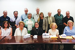 Catholics and other Christians from across central and southern Indiana pose on June 5 in the Indianapolis office of Sen. Todd Young with letters from their faith communities advocating for support of federal hunger programs. The letters were part of the annual “Offering of Letters” sponsored by Bread for the World, an ecumenical organization that seeks to end hunger in the U.S. and abroad. (Submitted photo)