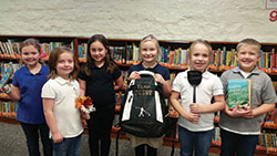 The smiles of Kaelen Hauersperger, left, Adylin Cox, Kaylen Cox, Brooklyn Woods, Eliza Kreutzjans and Drew Spurlock reflect their support for “Team Jesus,” the approach that guides students and staff members during this school year at St. Mary School in North Vernon. (Submitted photo)