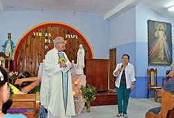 Father Jeffrey Godecker celebrates Mass at Nuevo Paraiso, a community for neglected children in Honduras, during a parish mission trip while he was pastor of Immaculate Heart of Mary Parish in Indianapolis. (Submitted photo)