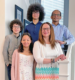 The LaRouche family poses for a photo with Brianna, left, and Nina in the front while Noah, left, Dominic and Andrew are behind them. (Submitted photo)