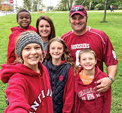 Brooklyn Ortman holds the camera for a selfie with her family—her siblings Holden, left, Brynklie and Hudson, and her parents, Alison and Jed. The couple adopted Holden five years ago. (Submitted photo)