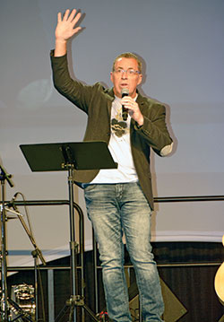 Steve Angrisano talks to teens about trusting in God during a National Catholic Youth Conference session in the Indiana Convention Center in Indianapolis on Nov. 19. (Photo by Natalie Hoefer)