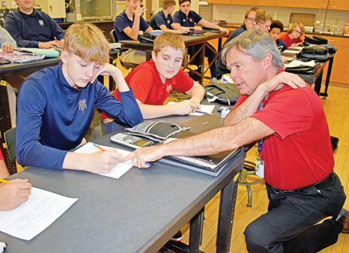 Dan Reichley is quick to help his students in his role as a math and science teacher at Seton Catholic High School in Richmond. (Submitted photo)