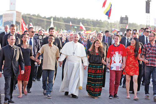 Pope Francis walks with young people from around the world during World Youth Day in 2016 in Krakow, Poland. (CNS photo/Paul Haring)