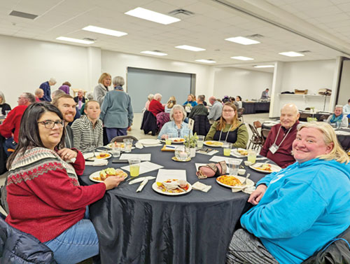 Participants in a “Rescue Project” evangelization program at St. Jude Parish in Indianapolis share a dinner during a Feb. 16 session at the Indianapolis South Deanery faith community. (Submitted photo)