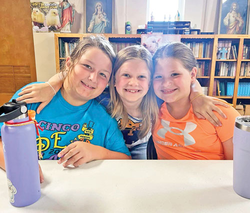 Maggie McBride, left, Katie Alley and Gabby Bickford show the joy that marked their involvement in the archdiocese’s Totus Tuus program in the Tell City Deanery during summer vacation of 2024. (Submitted photo)
