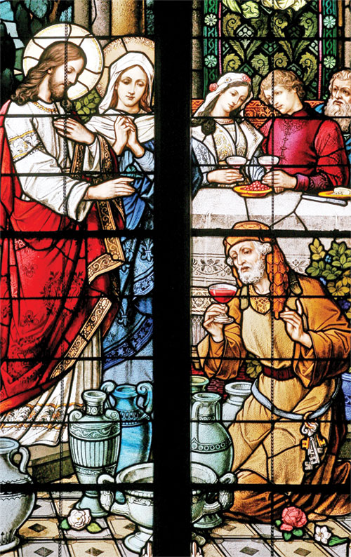 In this window from a church in the archdiocese, we see Jesus turn water into wine at the request of the Blessed Virgin Mary during the wedding at Cana. The parish where this window appears was established in 1837.