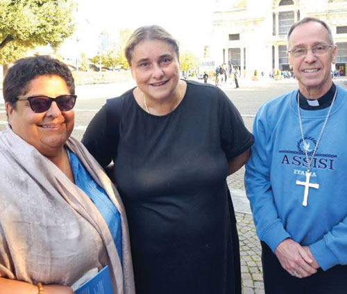 Archbishop Charles C. Thompson is pictured with Marilyn Santos, left, associate director of the Secretariat of Evangelization and Catechesis for the U.S. Conference of Catholic Bishops, and Antonia Salzano, St. Carlo Acutis’ mother, during a pilgrimage stop in Assisi, Italy. (Submitted photo courtesy of Marilyn Santos)