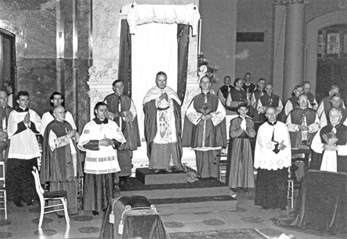 In this window from a church in the archdiocese, we see Jesus turn water into wine at the request of the Blessed Virgin Mary during the wedding at Cana. The parish where this window appears was established in 1837.