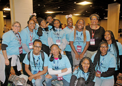 Youths and adult leaders of the group from St. Rita Parish in Indianapolis get ready to join in the fun and the faith of 16,000 youths coming together at the National Catholic Youth Conference in Indianapolis on Nov. 20-22. (Photo by John Shaughnessy)