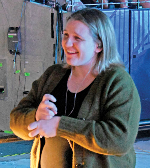 Megan Kenworthy signs during a general session in Lucas Oil Stadium in Indianapolis on Nov. 21 during the National Catholic Youth Conference. (Photo by Natalie Hoefer)