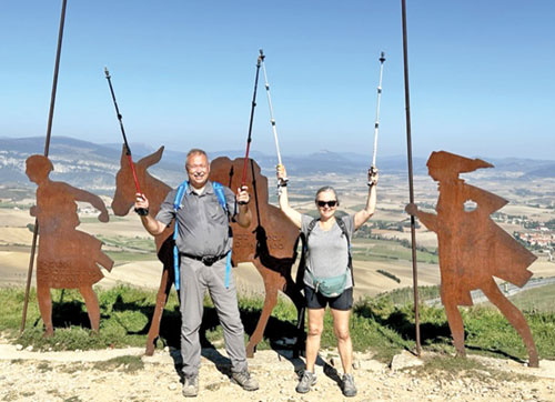 Dan and Karen Schoenfelder of Holy Family Parish in New Albany celebrate a moment during their journey along the Camino. (Submitted photo)