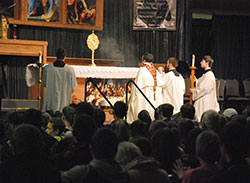 Seeing hundreds of teenagers join in adoration of the Blessed Sacrament “is a special experience,” chaperone Aissa Lazarz said. (Photos by Kevin Cullen)