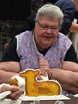 Felician Sister Anthony helps out the St. Adalbert’s Sisters’ Auxillary frosting lamb cakes, which are made from a secret recipe.