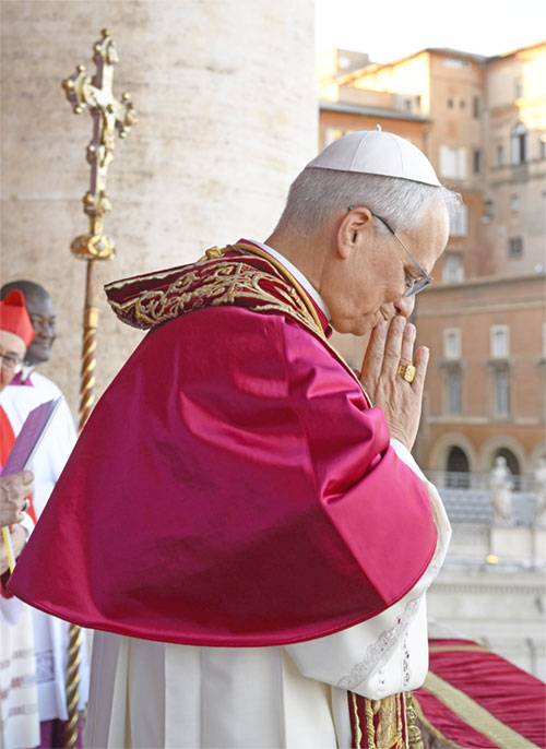 Pope Leo XIV, the former Cardinal Robert F. Prevost, waves to the crowds in St. Peter's Square at the Vatican after his election as pope May 8, 2025. The new pope was born in Chicago. (CNS photo/Vatican Media)